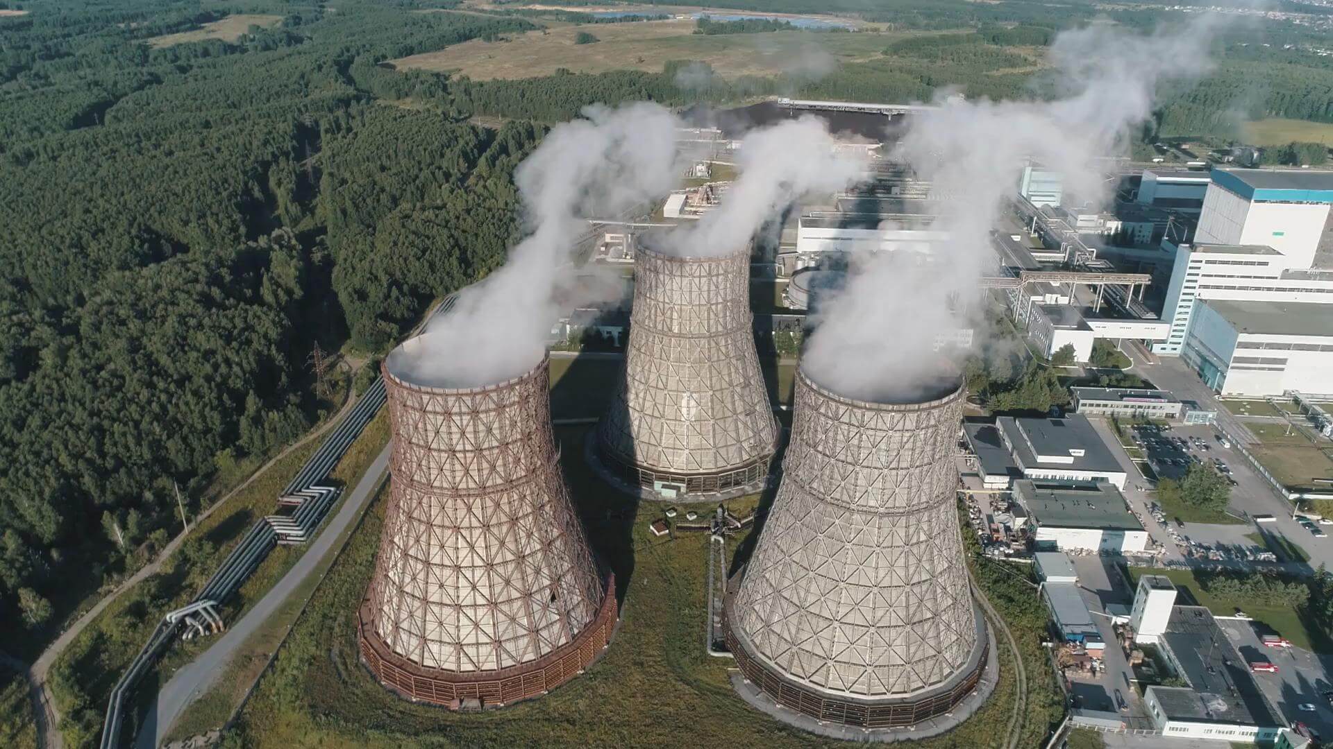 videoblocks-aerial-view-on-the-working-power-station-cooling-tower-of-nuclear-power-plant-coal-burning-power-plant_rgfknxjsq_1080__D_290.jpeg